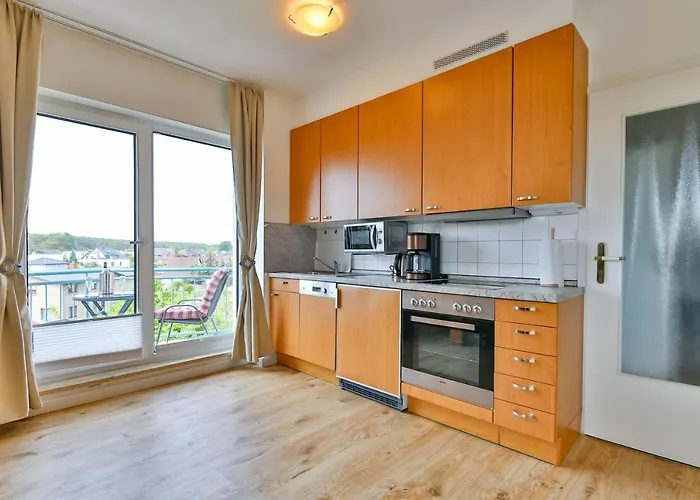 Tine Mit Balkon, Fahrraedern Und Strandkorb Im Sommer